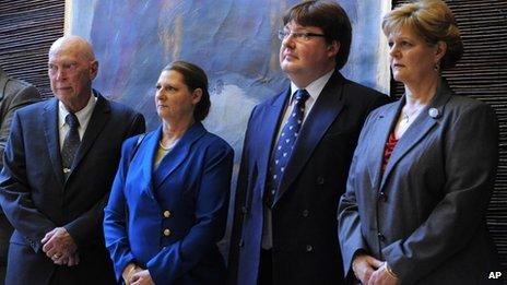 John Wesley Walker, left, and his wife Princess Irina of Romania, centre left, Alexander Phillips Nixon, centre right, and Princess Elena of Romania attend the opening of an exhibition in Bucharest Monday Oct 24, 2011