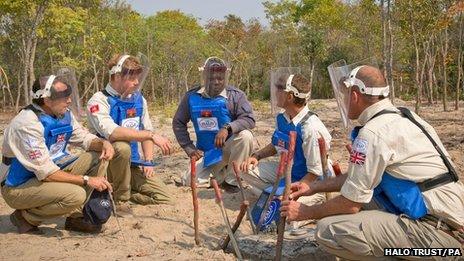 Prince Harry in Angola with HALO Trust officials in August 2013