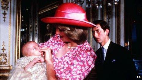 Princess Diana holds baby Prince William, as Prince Charles looks on
