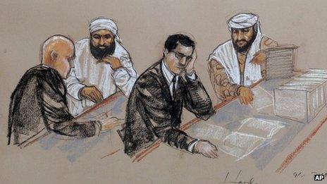 In this pool photo of a sketch by courtroom artist Janet Hamlin and reviewed by the US Department of Defense, accused 11 September co-conspirators Ammar al Baluchi, center left, and Ramzi Binalshibh, right, confer with their lawyers during pretrial hearings at the Guantanamo 19 August 2013
