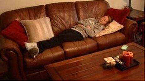 Teenager sleeping on couch