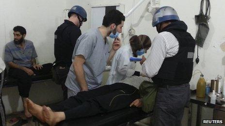 UN chemical weapons experts visit people affected by an apparent gas attack at a hospital in the south-western Damascus suburb of Mouadamiya on 26 August 2013