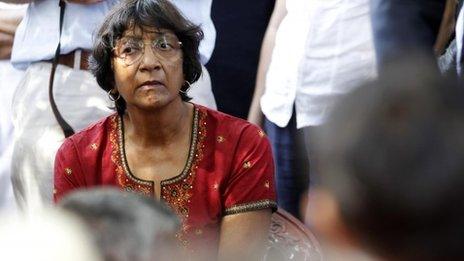 UN High Commissioner for Human Rights Navi Pillay listens to an ethnic Tamil war survivor during her visit to north Sri Lanka on 27 August 2013