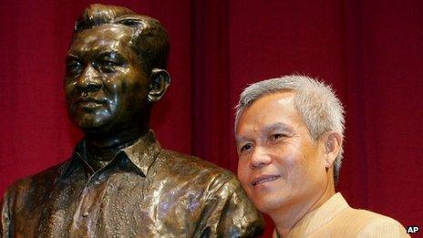File photo of Sombath Somphone of Laos, shown with the bust of former Philippine President Ramon Magsaysay in Manila after he won the award for community leadership in 2005