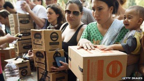 Israelis queue to collect gas mask kits at a distribution centre in the Mediterranean coastal city of Haifa, north of Israel, on August 29, 2013