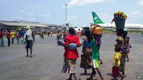 People on runway of Bangui international airport