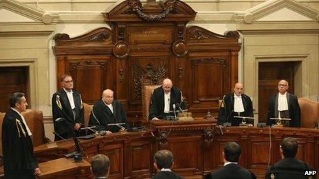 President of the Italian supreme court Antonio Esposito (C) reads the sentence at the end of the trial involving former Italian Prime Minister Silvio Berlusconi, on 1 August, 2013, at the Court of Cassation in Rome.