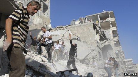 Men search for survivors amid rubbles of collapsed building after what activists said was shelling by forces loyal to Syria"s President Bashar al-Assad in Aleppo"s Fardous neighborhood August 26, 2013