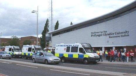 Police vans outside Racecourse stadium