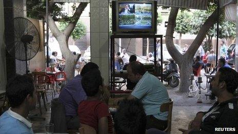 Egyptians watch television