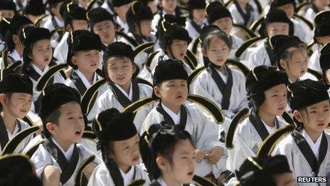 Pupils in traditional costumes attend a ceremony at the Confucius temple in Nanjing, Jiangsu province 1 September 2013