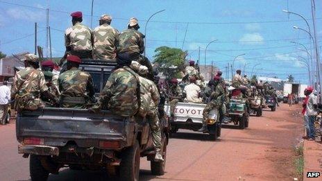 Troops in charge of disarmament ride through Bangui on 5 September 2013