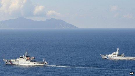 A China coast guard vessel, left, is followed by a Japan coast guard ship as it sailed near the disputed East China Sea islands called Senkaku by Japan and Diaoyu by China, 10 September 2013