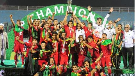 Afghan team celebrate winning the South Asian Federation Championship after defeating India 2-0 on 11 September 2013