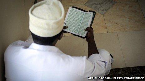 A delegate reading the Koran at the National Conference on Tackling Extremism in Somalia - September 2013