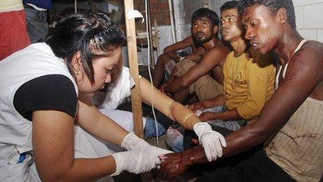 Nurse treats a man injured in the Manipur (12 September 2013)