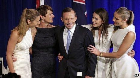 Australian opposition leader Tony Abbott, third left, and his daughters Frances, left, Louise, second right, and Bridget, right, and his wife Margaret, second left, come to the stage to celebrate his election victory in Sydney, 7 September 2013