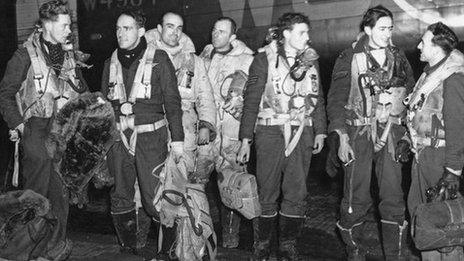 The crew of an RAF Lancaster bomber at a British airfield on their return from an overnight raid on Stettin, Poland, 6 January 1944