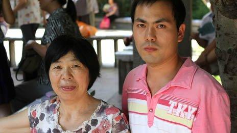 Zhang Junfei and his mother at a marriage market in Jade Lake Park Beijing