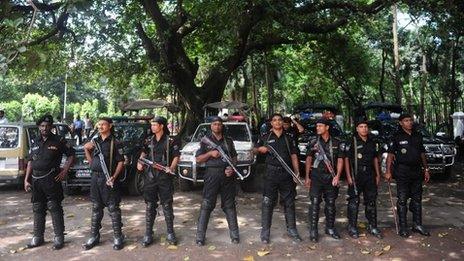 Rapid Action Battalion (RAB) personnel stand guard in front of the special court in Dhaka on 1 October 2013.