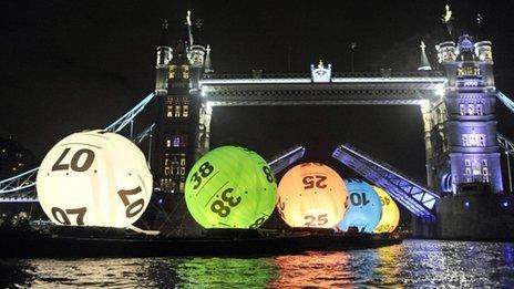 Lottery balls float down the Thames