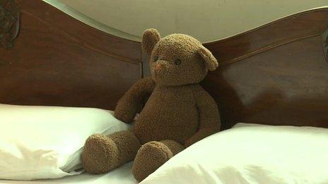 Teddy bear on bed