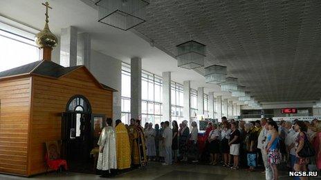Wooden church inside a railway station in Russia