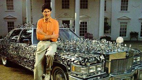 Uri Geller with a car covered in spoons
