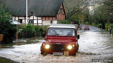 A Land Drover tackling floods near Anne Hathaway's cottage