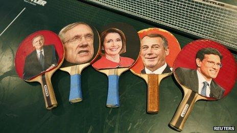 Table tennis paddles bear the pictures of key congressional leaders