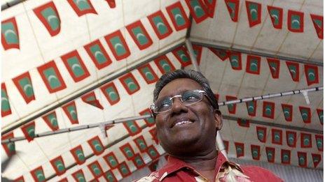 Mohamed Waheed smiles during a political meeting with his supporters in Male 6 September