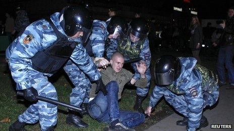 Special anti-riot police arrest a protester in Moscow