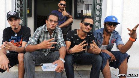 Tunisian rappers Seif Khrissi (Tuniaif), Bilel Matmati (MC Bilel), Mohamed Soufienne (Jok boss), Moez Belhaj (T-Gang) and Mohamed Kadri (BMG) pose after a press conference to announce the creation of a rapper trade union in Tunis