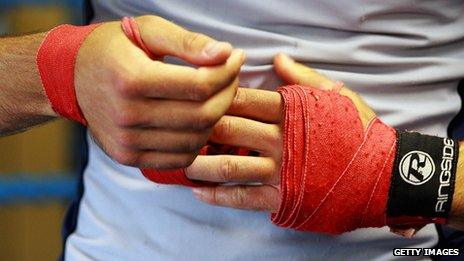 Boxer's hands being wrapped