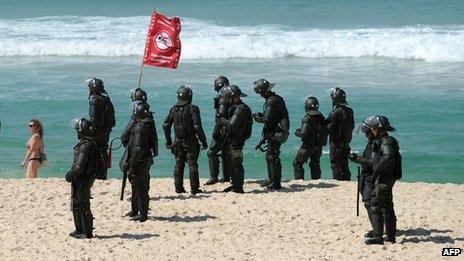Members of the security forces block off the beachfront in Barra da Tijuca