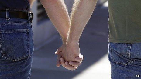 File image of two men holding hands