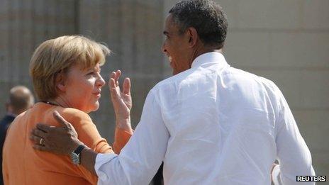 File photo of U.S. President Barack Obama chatting with German Chancellor Angela Merkel after their speeches at the Brandenburg Gate in Berlin, June 19, 2013.