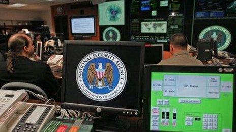 Employees sit at their stations at the NSA's Threat Operations Center.