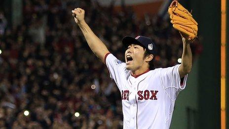 Boston Red Sox relief pitcher Koji Uehara celebrates victory in the World Series