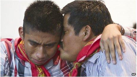 Alberto Patishtan kisses his son Hector