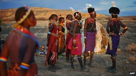 Men and women from the Turkana tribe take part in a ceremony in the Sibiloi national Park in the Turkana region