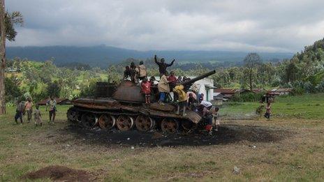 In Kibumba, children play on a former M23 tank. The rebels burned it before retreating.
