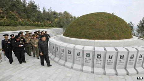 Undated picture released by North Korea's official Korean Central News Agency (KCNA) on 2 November 2013 shows North Korean leader Kim Jong-un (front R) visiting the cemetery of fallen fighters of the KPA Navy Unit 790 at an undisclosed location in North Korea