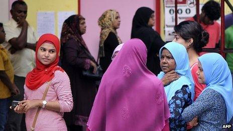 Maldivian voters line up at a local polling station in Male