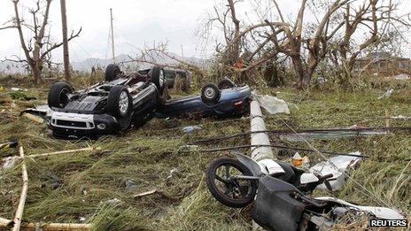 Cars swept into a rice field in Tacloban. 9 Nov 2013