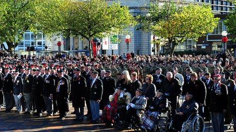Members of the Armed Forces and veterans stand at Centenary Square, Birmingham, during a Remembrance Sunday service