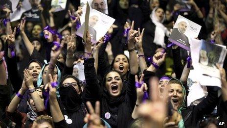 Supporters of Hassan Rouhani cheer at a campaign rally in Tehran in June 2013