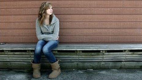 Teenage girl on bench