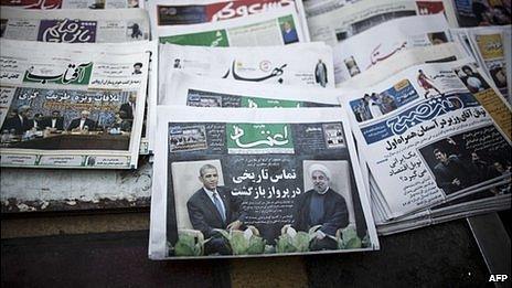 A file picture taken on on September 28, 2013, shows Iranian newspapers with pictures depicting Iranian President Hassan Rouhani, US President Barack Obama, Iranian Foreign Minister Mohammad Javad Zarif and his American counterpart John Kerry on a newsstand in Tehran