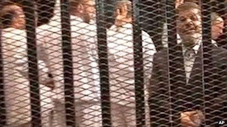 Mohammed Morsi on trial in a Cairo courtroom on 4 November 2013